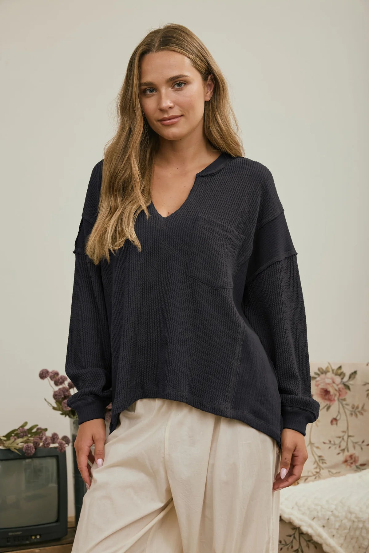Split Neck Raw Edge Long Sleeve Ribbed Knit Top