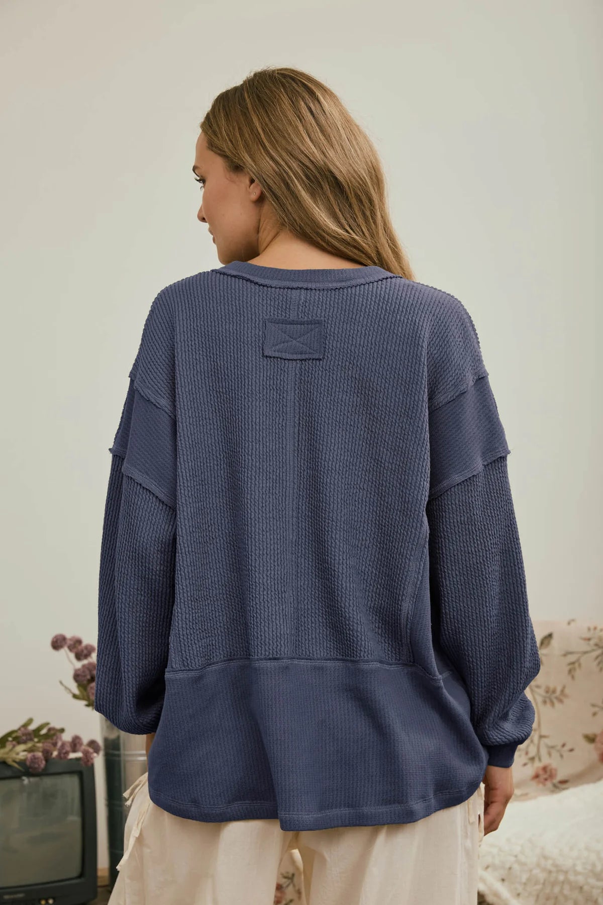 Split Neck Raw Edge Long Sleeve Ribbed Knit Top